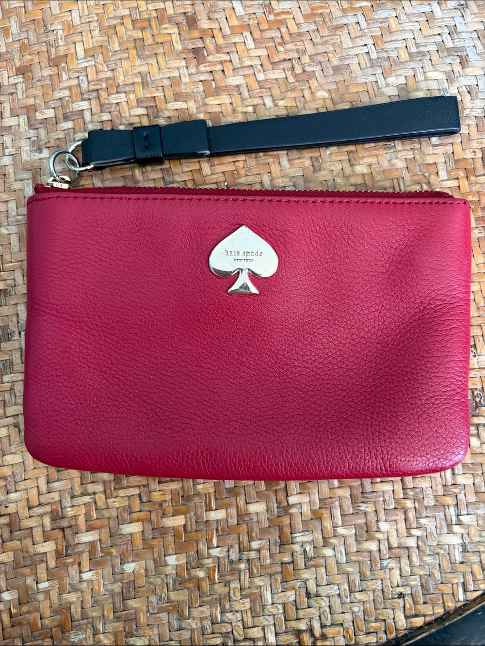 kate spade Red Pebbled Leather Wristlet with Black Strap in Used Condition